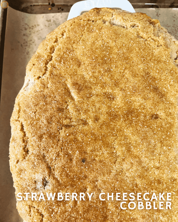 whole, uncut dish of Strawberry Cheesecake Cobbler