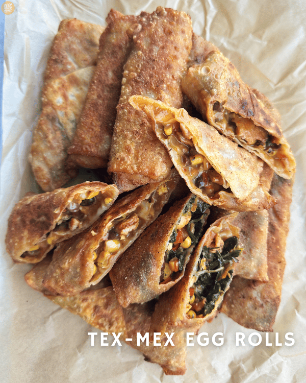 large pile of Tex-Mex Egg Rolls on parchment paper