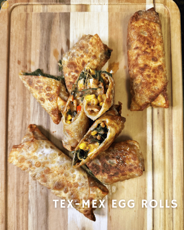 Tex-Mex Egg Rolls on a wooden cutting board