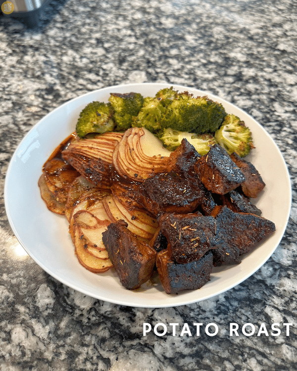 a diner of cajun butter steak tips, easy roasted broccoli, and a serving of crispy potato roast 