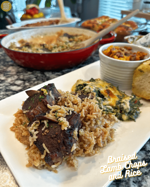 Braised Lamb Chops and Rice plated alongside Spinach Maria and Sweet Potato Souffle. 